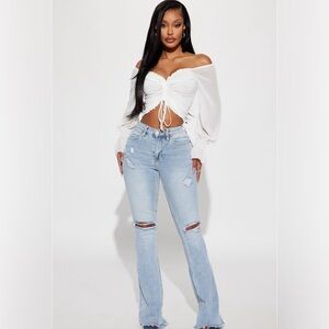 Fashion Nova ripped flare jeans